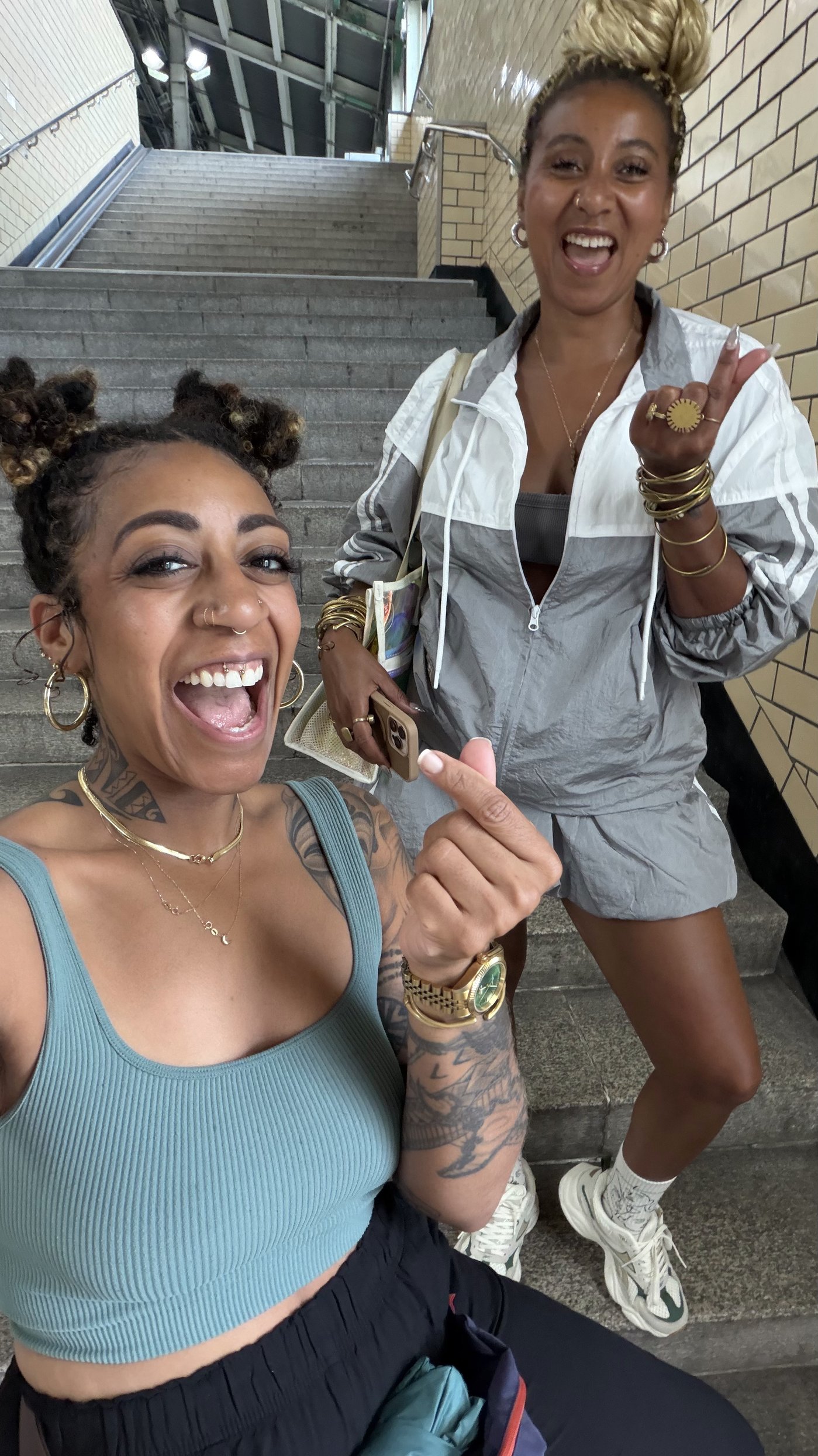 Ashleigh Bing and a friend laughing on a stairwell in Korea