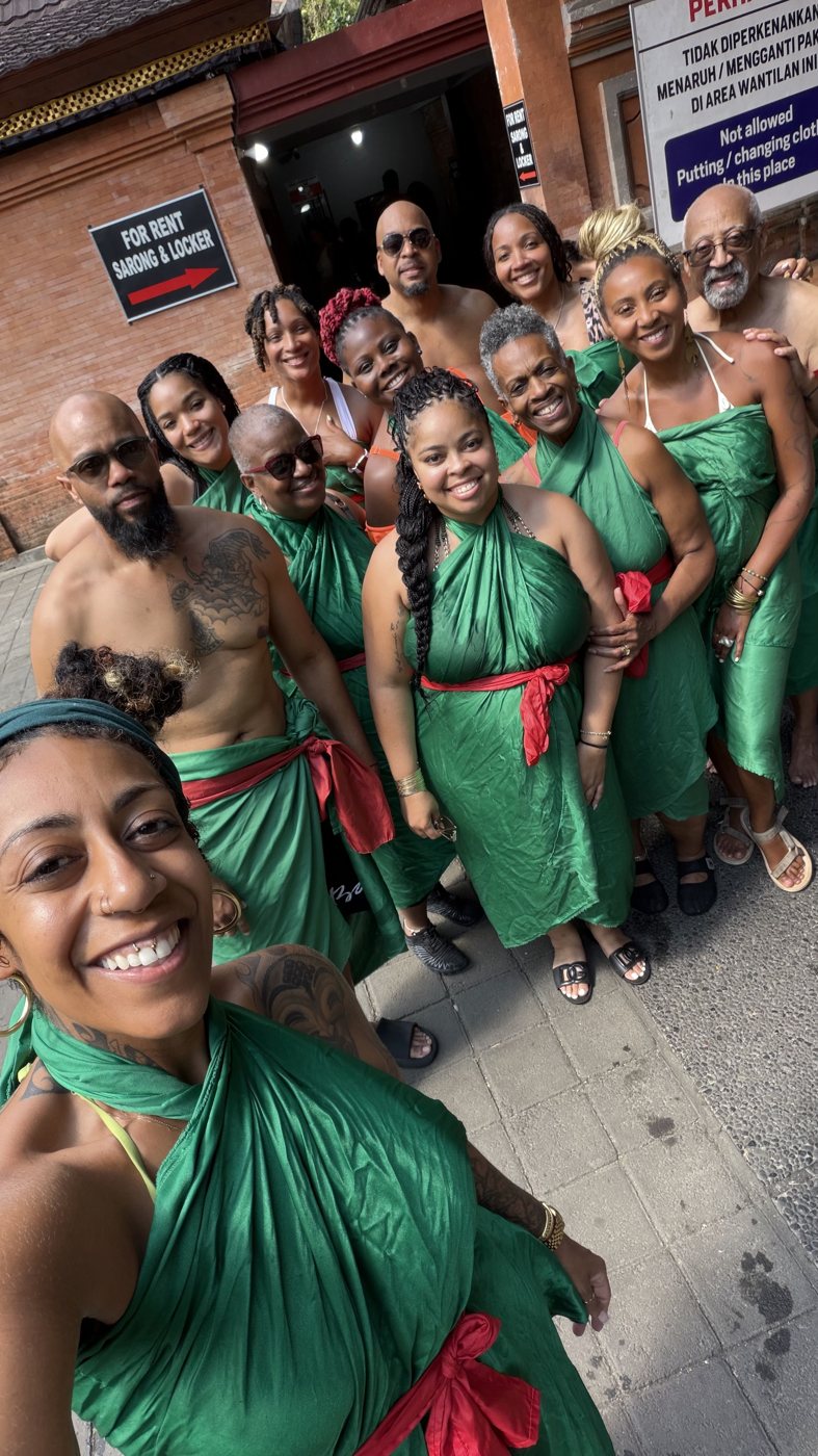 The group dressed in traditional green for a ceremony in Bali