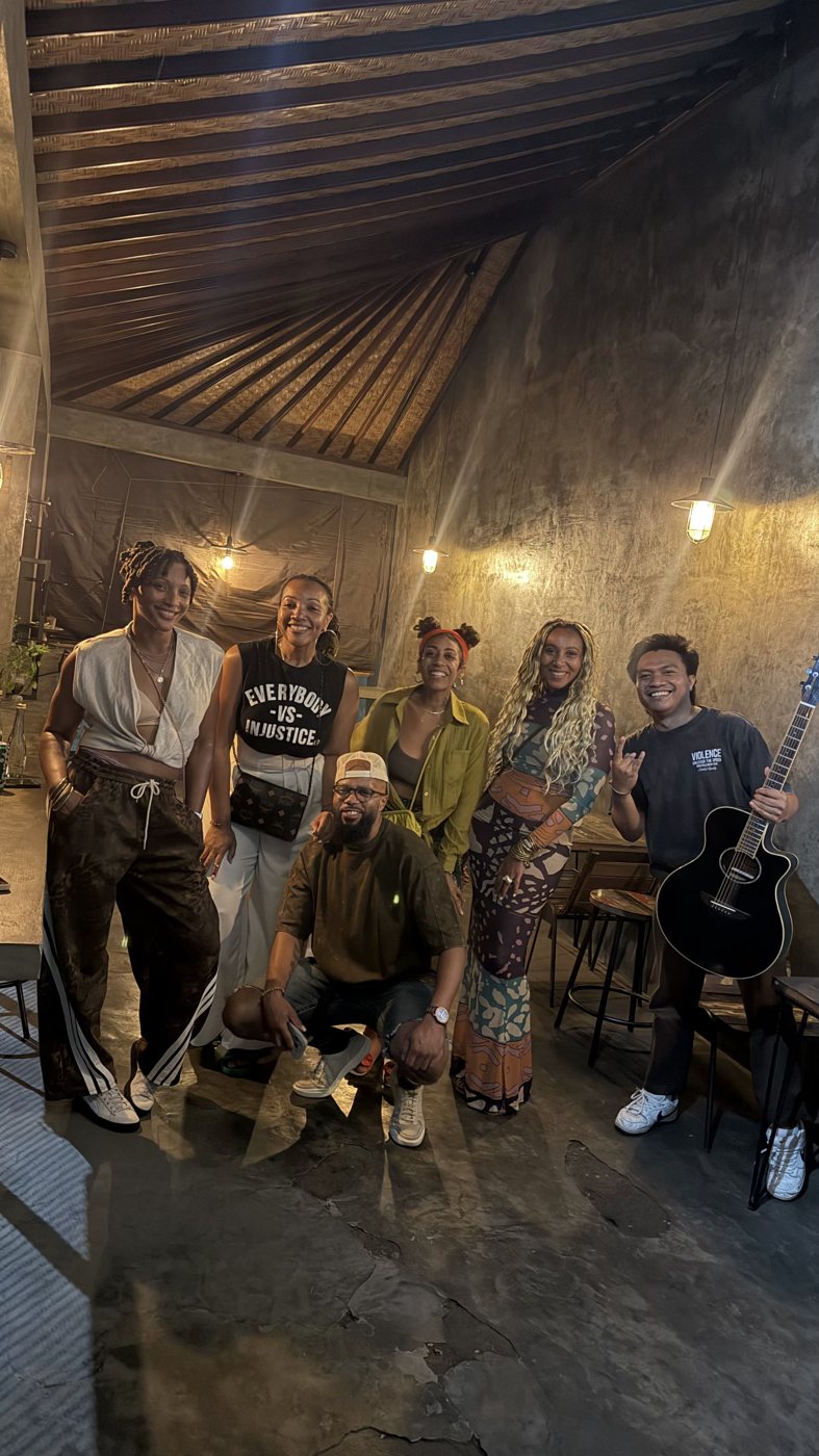 The group with a local guitarist in Bali