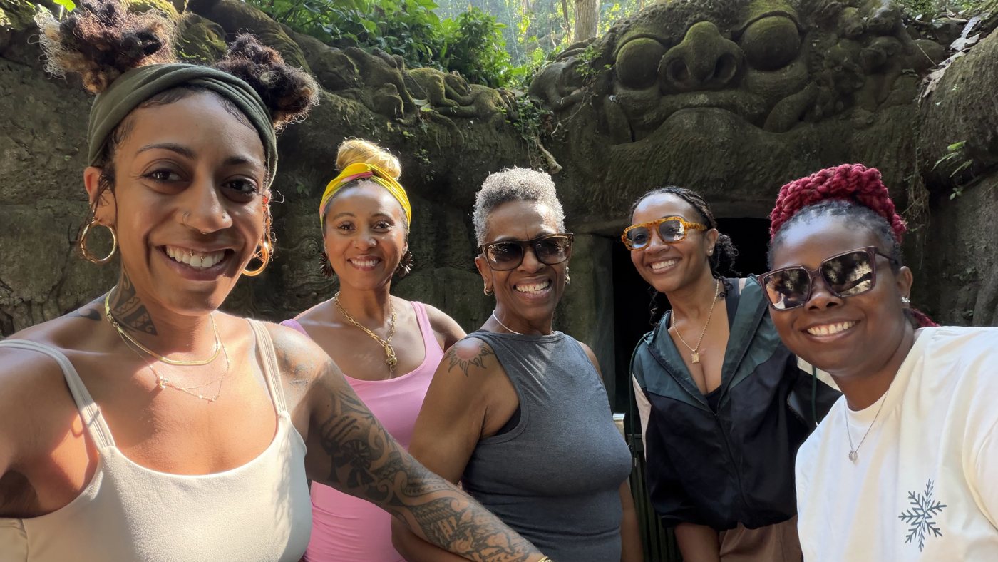 Ashleigh Bing with a group at ancient ruins in Bali