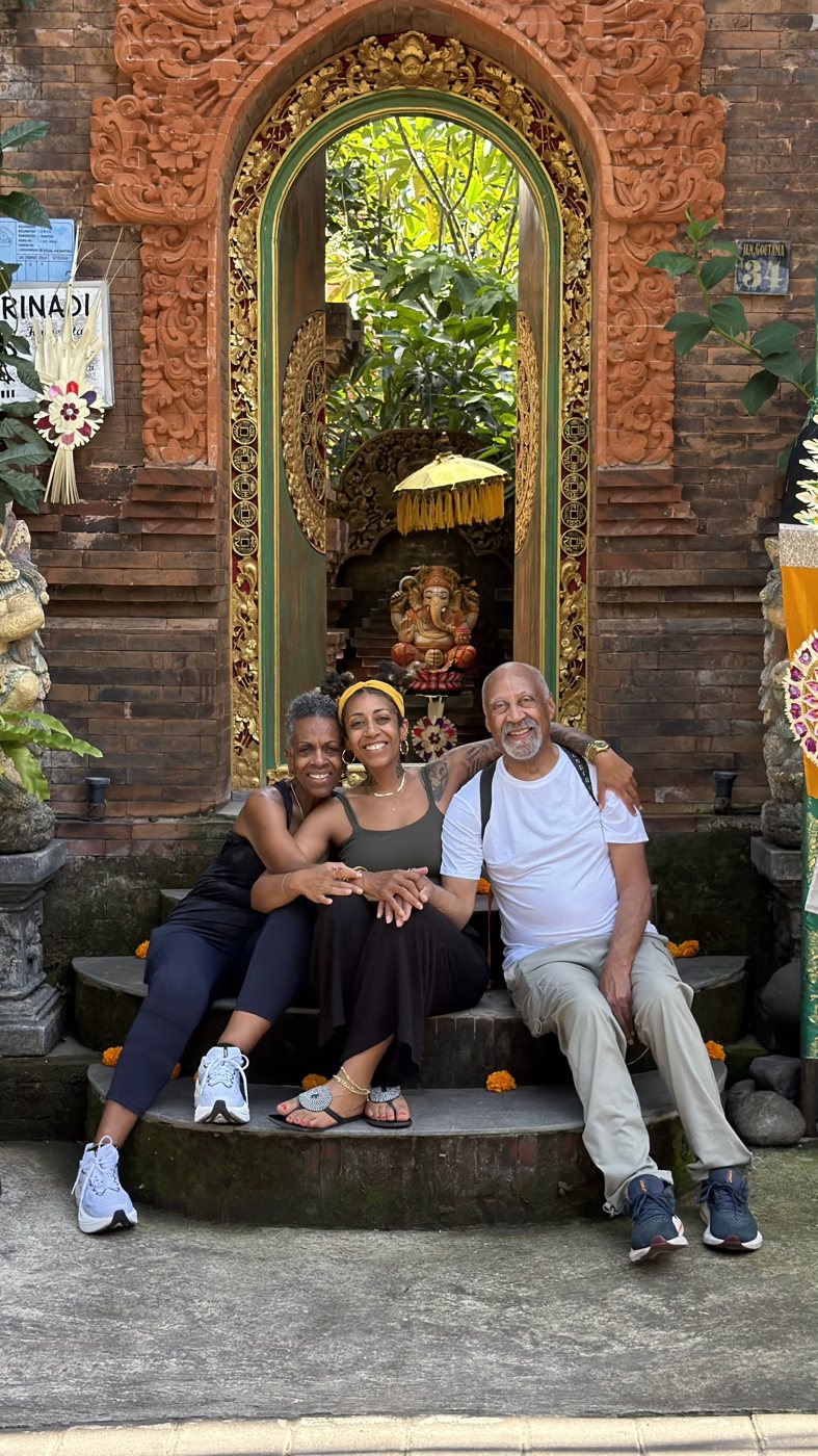 The group sitting on temple steps in Bali