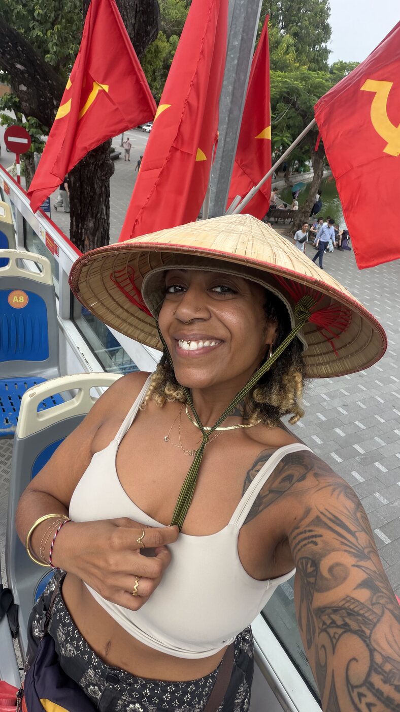 Ashleigh Bing wearing a conical hat in Vietnam