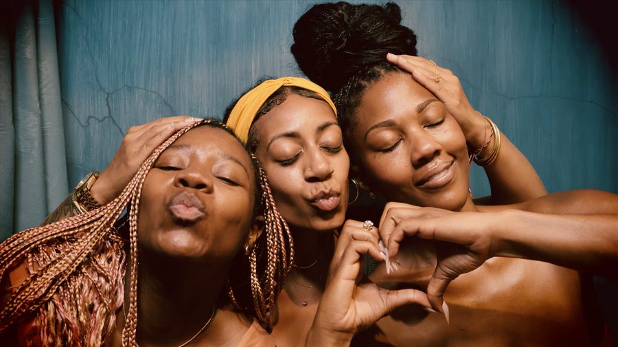 Ashleigh Bing with two friends in a photobooth
